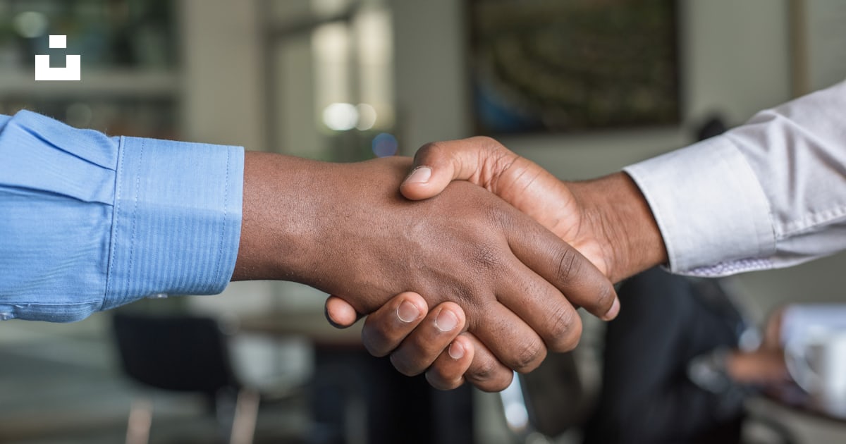 Two people shaking hands, agreeing to work together